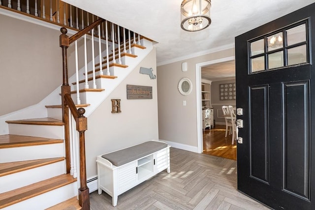 foyer with parquet floors, crown molding, and an inviting chandelier