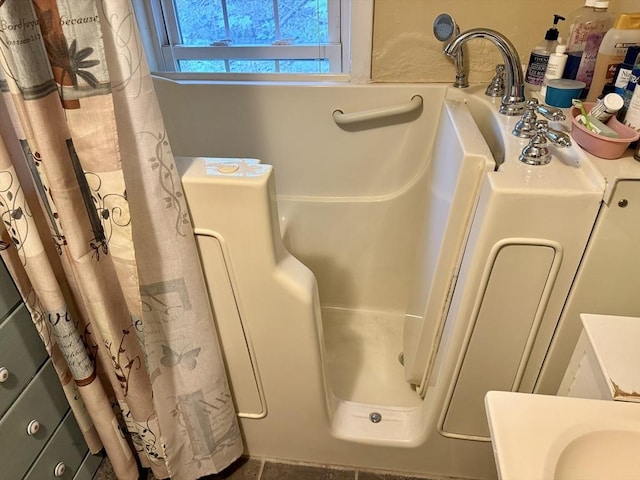 bathroom with a shower with shower curtain