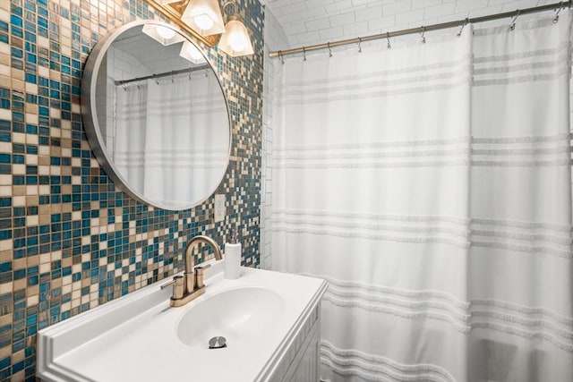 bathroom with tile walls and vanity