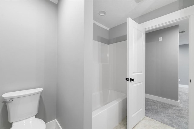 bathroom featuring shower / bathtub combination, toilet, and baseboards