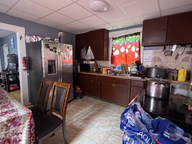 40 Freeman St, Framingham, MA 01702 - kitchen featuring stainless steel fridge with ice dispenser, a drop ceiling, tasteful backsplash, a sink, and light tile patterned floors