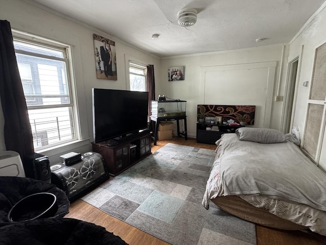 40 Freeman St, Framingham, MA 01702 - bedroom featuring ornamental molding and wood finished floors