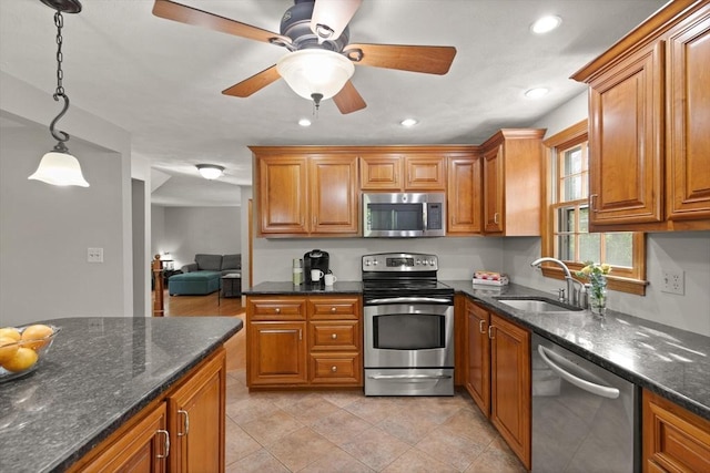 6 2nd Ave, Wilmington, MA 01887 - kitchen featuring appliances with stainless steel finishes, a sink, brown cabinetry, recessed lighting, and a ceiling fan