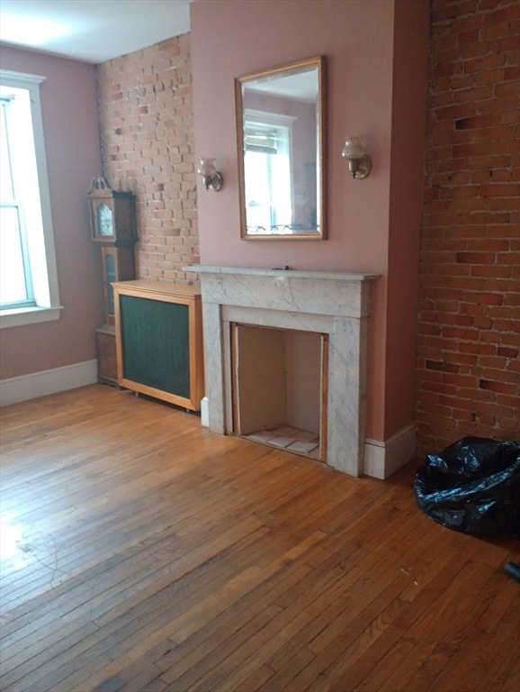 unfurnished living room with light hardwood / wood-style floors