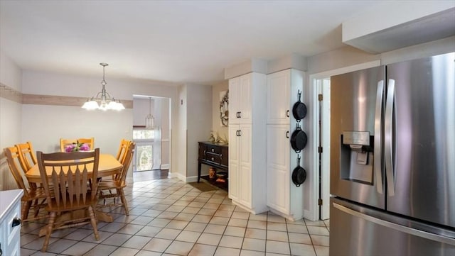 28 Philmart Dr, New Ipswich, NH 03071 - dining space featuring a chandelier and light tile patterned floors