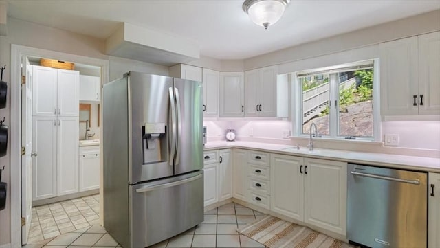 28 Philmart Dr, New Ipswich, NH 03071 - kitchen featuring stainless steel appliances, white cabinetry, light countertops, and light tile patterned floors