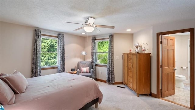 28 Philmart Dr, New Ipswich, NH 03071 - bedroom featuring multiple windows, light colored carpet, ensuite bathroom, a textured ceiling, and recessed lighting