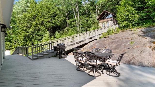 28 Philmart Dr, New Ipswich, NH 03071 - deck with outdoor dining area, area for grilling, and view of wooded area