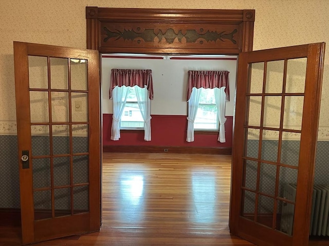 41 Mayland St, Fitchburg, MA 01420 - spare room featuring wood finished floors and radiator heating unit