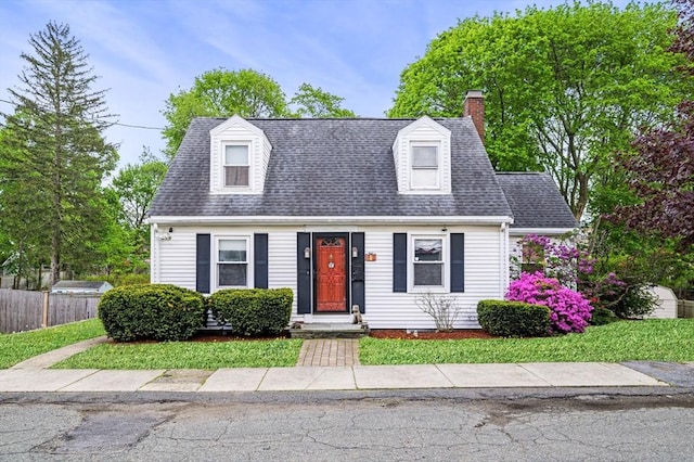 7 Beaver St, Beverly, MA 01915 - cape cod house featuring a chimney and roof with shingles