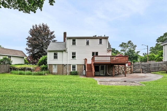 7 Beaver St, Beverly, MA 01915 - rear view of property featuring stairs, a wooden deck, a chimney, a patio, and a gate