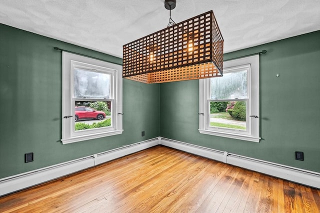 7 Beaver St, Beverly, MA 01915 - empty room featuring hardwood / wood-style floors, plenty of natural light, and baseboards