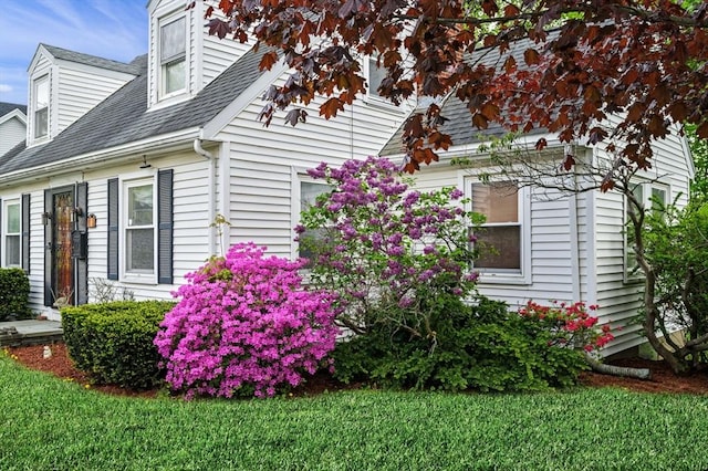 7 Beaver St, Beverly, MA 01915 - view of side of home featuring a shingled roof and a lawn