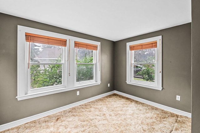 7 Beaver St, Beverly, MA 01915 - carpeted empty room featuring plenty of natural light and baseboards