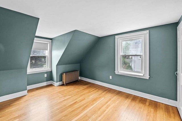 7 Beaver St, Beverly, MA 01915 - additional living space featuring radiator heating unit, wood-type flooring, baseboards, and lofted ceiling