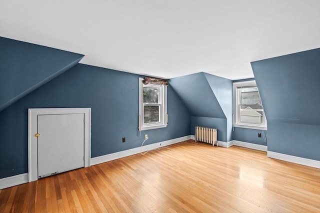 7 Beaver St, Beverly, MA 01915 - bonus room with radiator heating unit, hardwood / wood-style floors, lofted ceiling, and baseboards