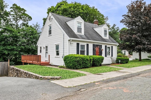 7 Beaver St, Beverly, MA 01915 - cape cod-style house with a wooden deck, a chimney, a shingled roof, and a front yard