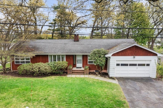 single story home featuring driveway, a chimney, a garage, a front yard, and roof with shingles