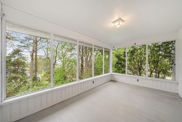 unfurnished sunroom featuring plenty of natural light