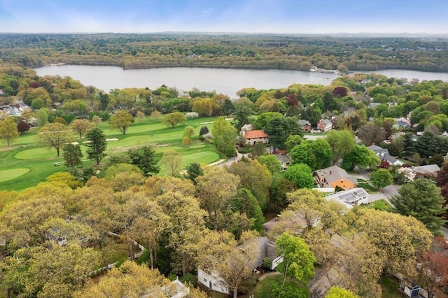 aerial view of property and surrounding area with a large body of water and a golf club