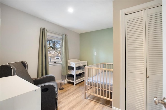 bedroom featuring a closet and wood finished floors