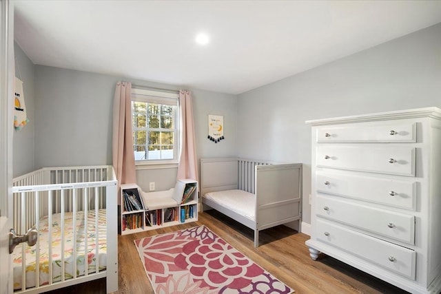 bedroom featuring wood finished floors