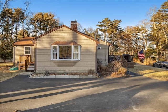 view of home's exterior featuring a chimney