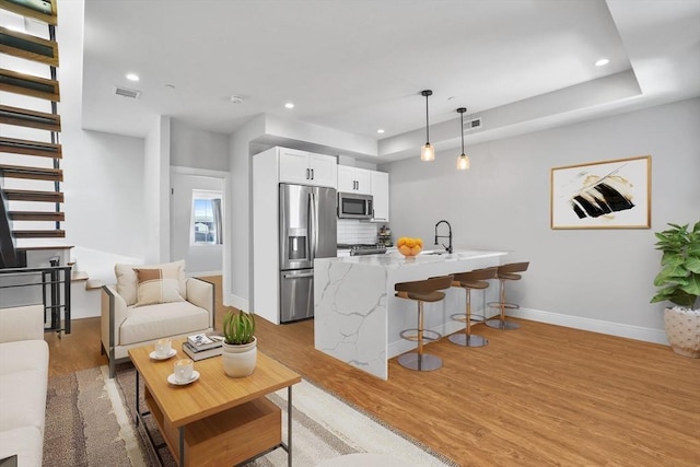 174 W 7th St Three, Unit Three, Boston, MA 02127 - living area featuring light wood-type flooring, baseboards, and recessed lighting