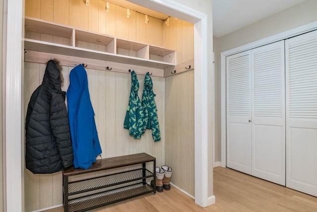 mudroom with baseboards and wood finished floors