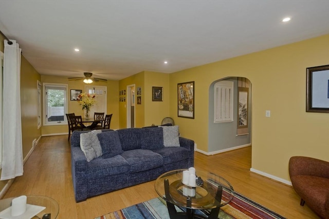 115 Carnavon Cir, Springfield, MA 01109 - living area with arched walkways, wood finished floors, ceiling fan, and recessed lighting