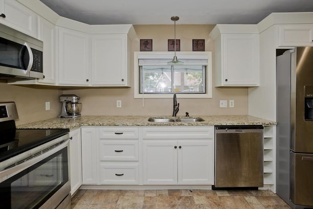 115 Carnavon Cir, Springfield, MA 01109 - kitchen featuring stainless steel appliances, white cabinets, and light stone counters