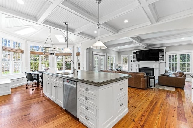 25 Wedgemere Ave, Winchester, MA 01890 - kitchen with dishwasher, coffered ceiling, a sink, hardwood / wood-style flooring, and dark countertops