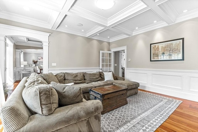 25 Wedgemere Ave, Winchester, MA 01890 - living area featuring decorative columns, wood finished floors, beam ceiling, coffered ceiling, and ornamental molding