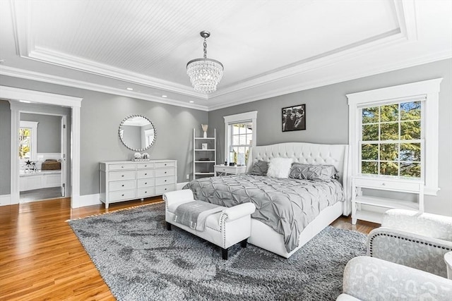 25 Wedgemere Ave, Winchester, MA 01890 - bedroom featuring a raised ceiling, multiple windows, crown molding, a chandelier, and light wood-type flooring