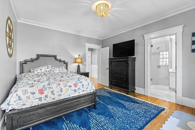 25 Wedgemere Ave, Winchester, MA 01890 - bedroom with ornamental molding, wood finished floors, baseboards, and ensuite bathroom