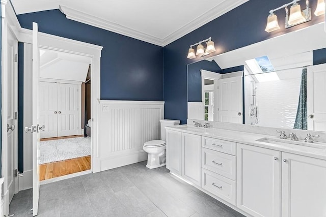 25 Wedgemere Ave, Winchester, MA 01890 - bathroom with toilet, crown molding, a stall shower, double vanity, and tile patterned flooring