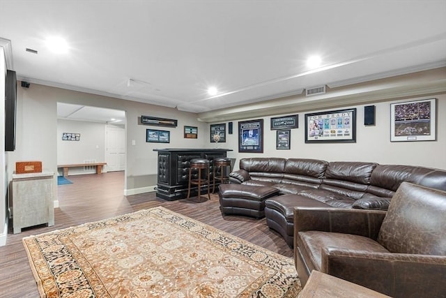 25 Wedgemere Ave, Winchester, MA 01890 - living room with dark wood-style flooring, ornamental molding, recessed lighting, a bar, and baseboards