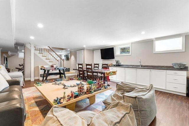 25 Wedgemere Ave, Winchester, MA 01890 - living room featuring stairway, recessed lighting, wood finished floors, and bar with sink
