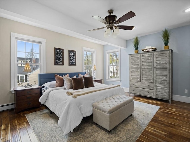 bedroom with baseboards, dark wood-style floors, and ceiling fan