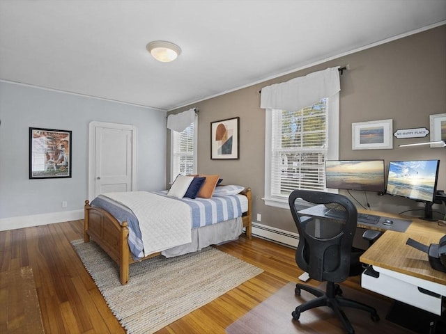 bedroom featuring baseboards, a baseboard radiator, ornamental molding, and wood finished floors