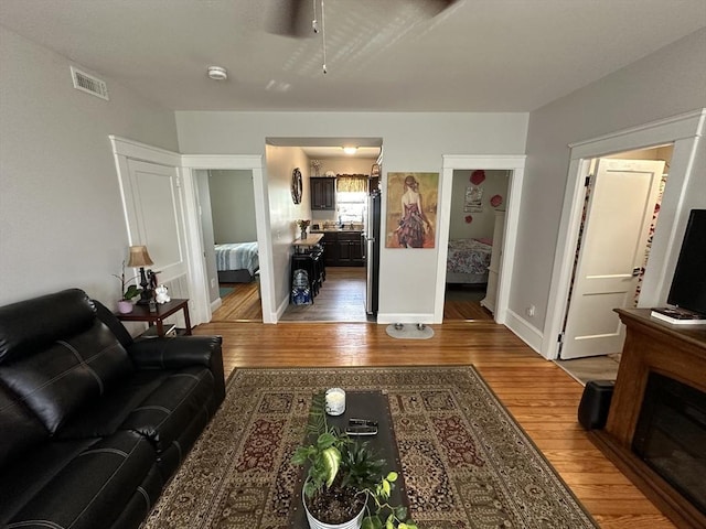 144-146 Irving St, Fall River, MA 02723 - living room with wood finished floors and a ceiling fan