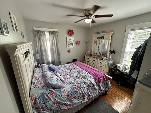 144-146 Irving St, Fall River, MA 02723 - bedroom featuring multiple windows, wood finished floors, and ceiling fan