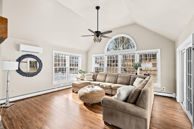 living area featuring a wall unit AC, a ceiling fan, baseboard heating, and wood finished floors