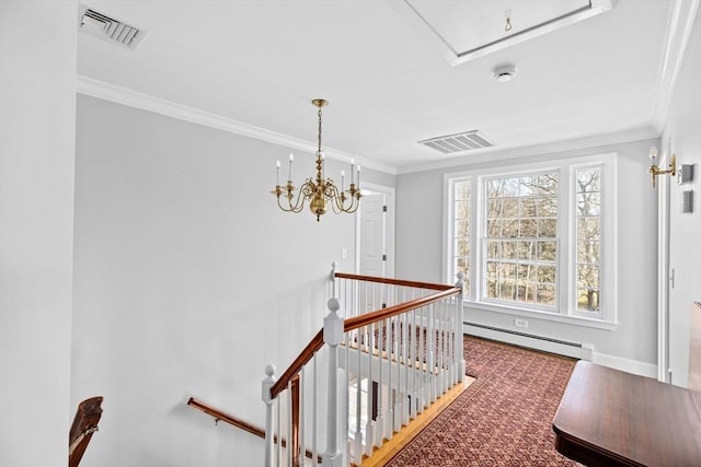 corridor with a baseboard heating unit, ornamental molding, visible vents, and an upstairs landing