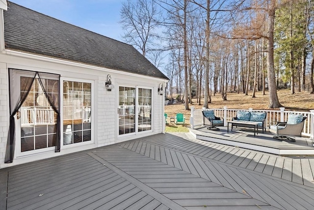 deck featuring outdoor lounge area