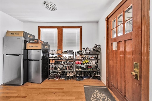 11 Murphy Ct, Newton, MA 02458 - kitchen featuring freestanding refrigerator, wood finished floors, and healthy amount of natural light