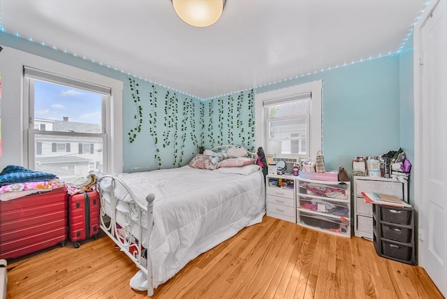 11 Murphy Ct, Newton, MA 02458 - bedroom featuring multiple windows and wood finished floors