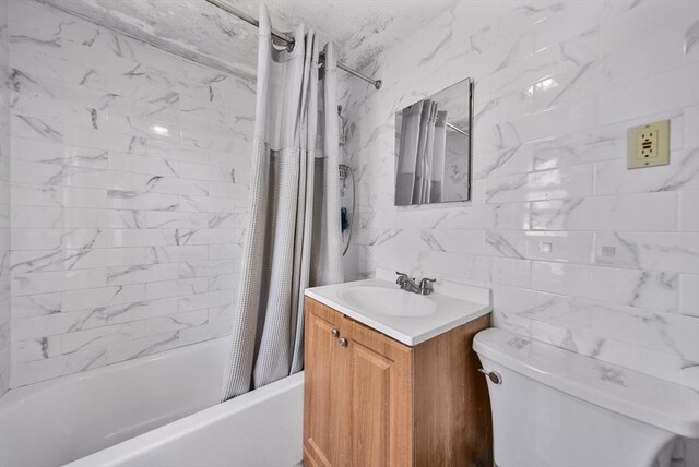 11 Murphy Ct, Newton, MA 02458 - bathroom featuring toilet, shower / tub combo, vanity, and tile walls