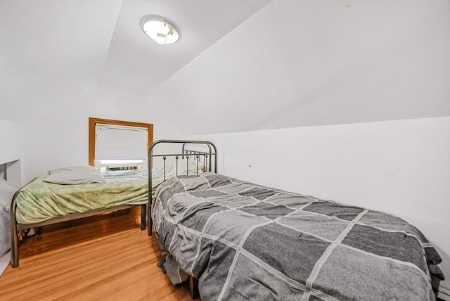11 Murphy Ct, Newton, MA 02458 - bedroom featuring vaulted ceiling and wood finished floors