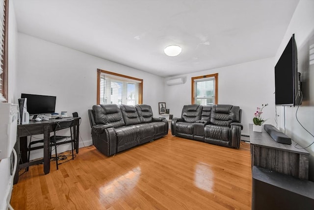 11 Murphy Ct, Newton, MA 02458 - living area with an AC wall unit, light wood-style flooring, an office area, and baseboard heating